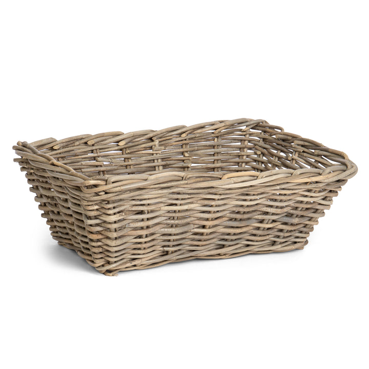 A rectangular woven wicker basket with a natural light brown and beige tone, shown on a plain white background.