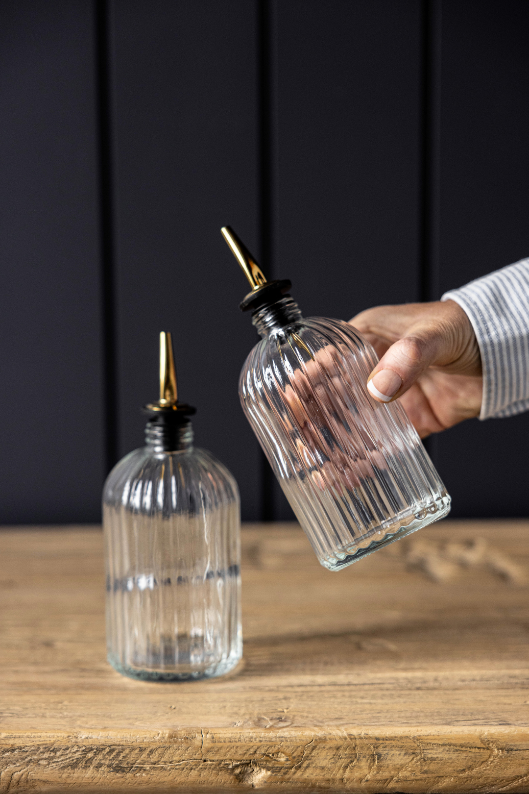 clear glass olive oil bottles with gold spout