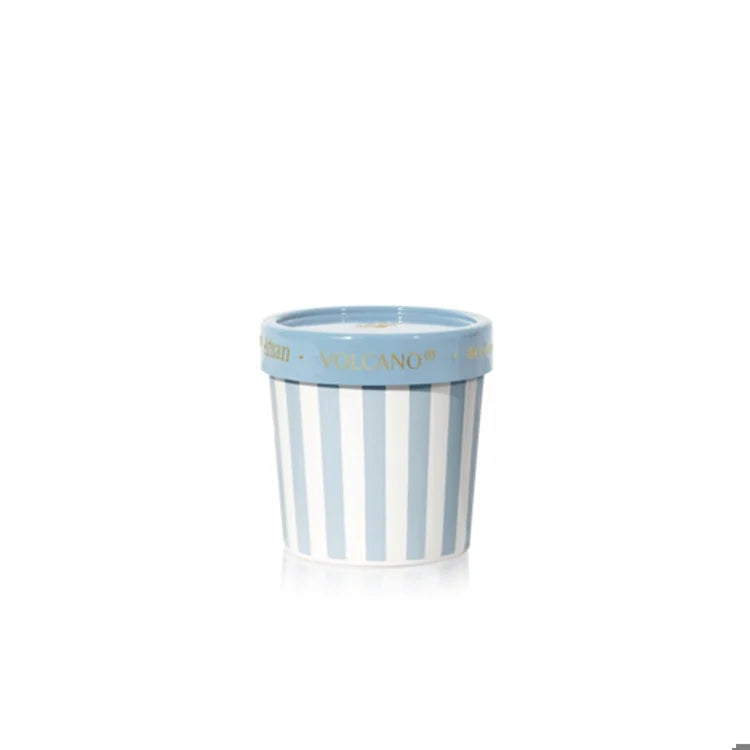 Striped ceramic gelato cup volcano candle with blue and white design on a white background