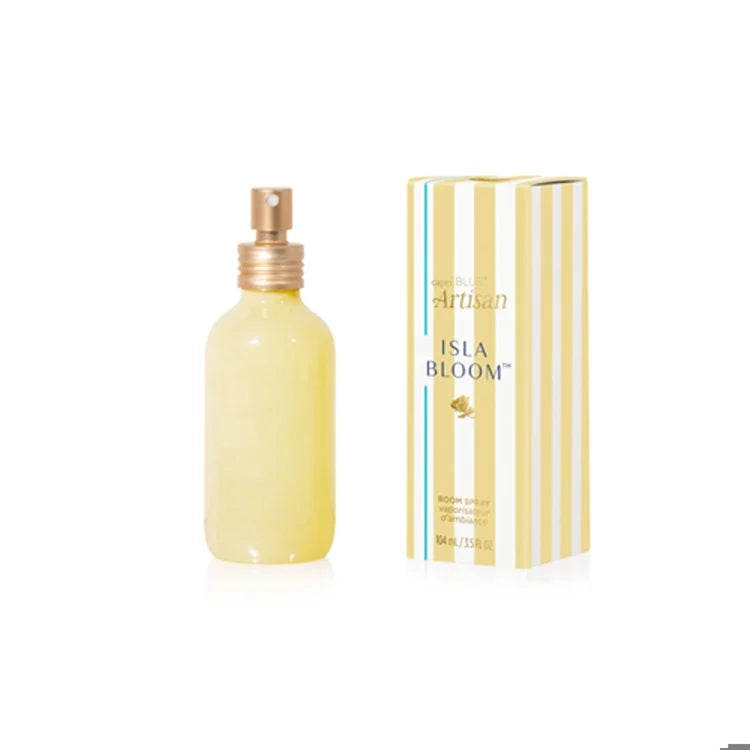 Yellow bottle of Isla Bloom room spray with packaging