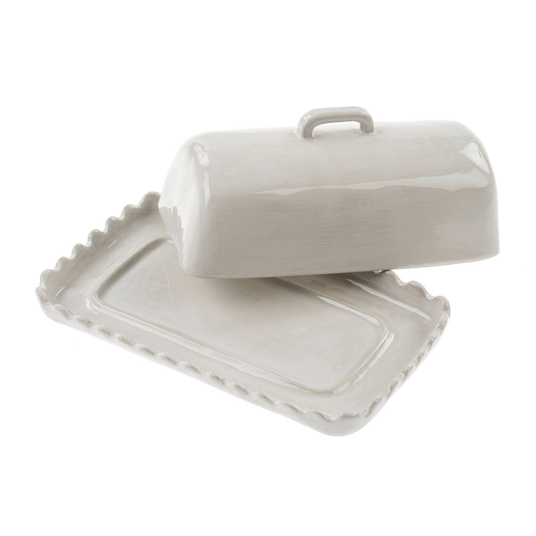 White ceramic butter dish with lid on a white background
