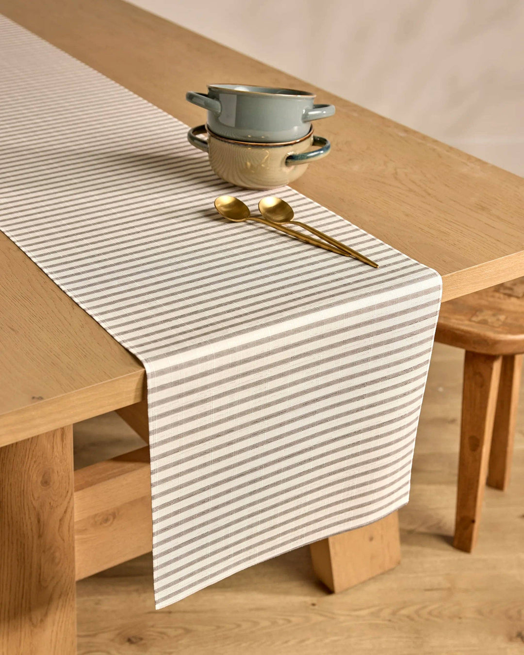 Table runner with striped pattern on a wooden table