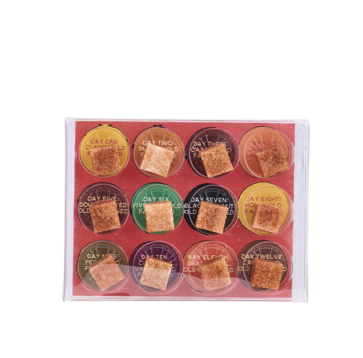 Set of twelve round containers with brown squares on a pink background