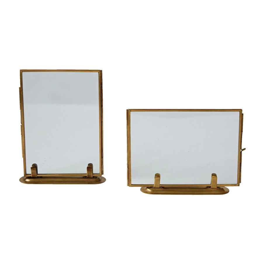 horizontally and vertically displayed glass frames with gold frame