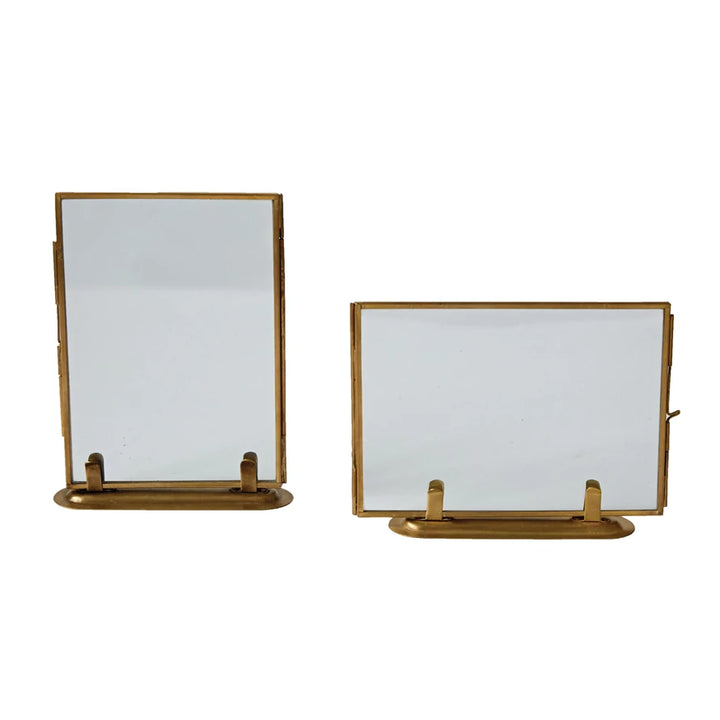 horizontally and vertically displayed glass frames with gold frame