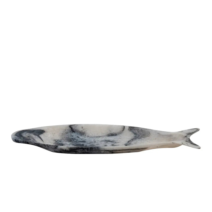Marble-patterned fish-shaped object on a white background