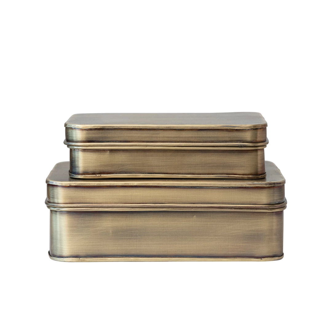 Set of two brass-colored rectangular boxes on a white background