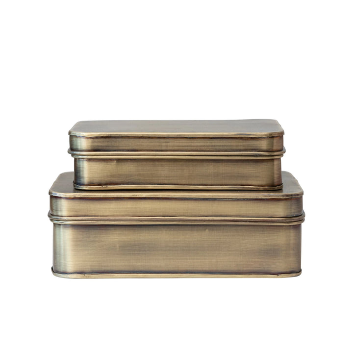 Set of two brass-colored rectangular boxes on a white background