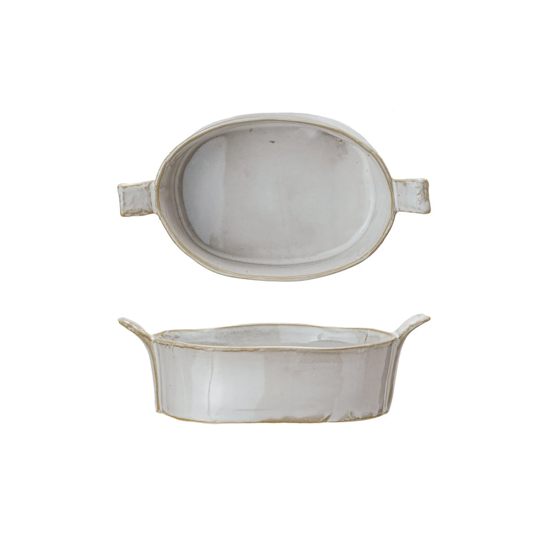 Two ceramic bowls with handles on a white background