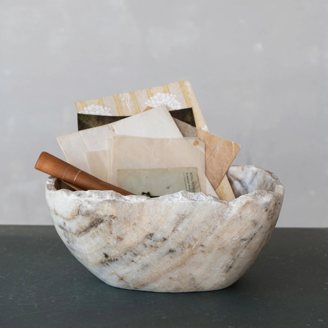Marble bowl with gray and beige grain and rough edges