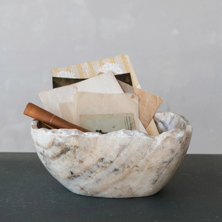 Marble bowl with gray and beige grain and rough edges