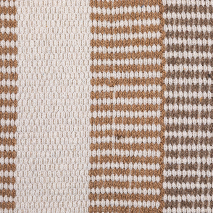 close-up woven white blanket with brown stripes