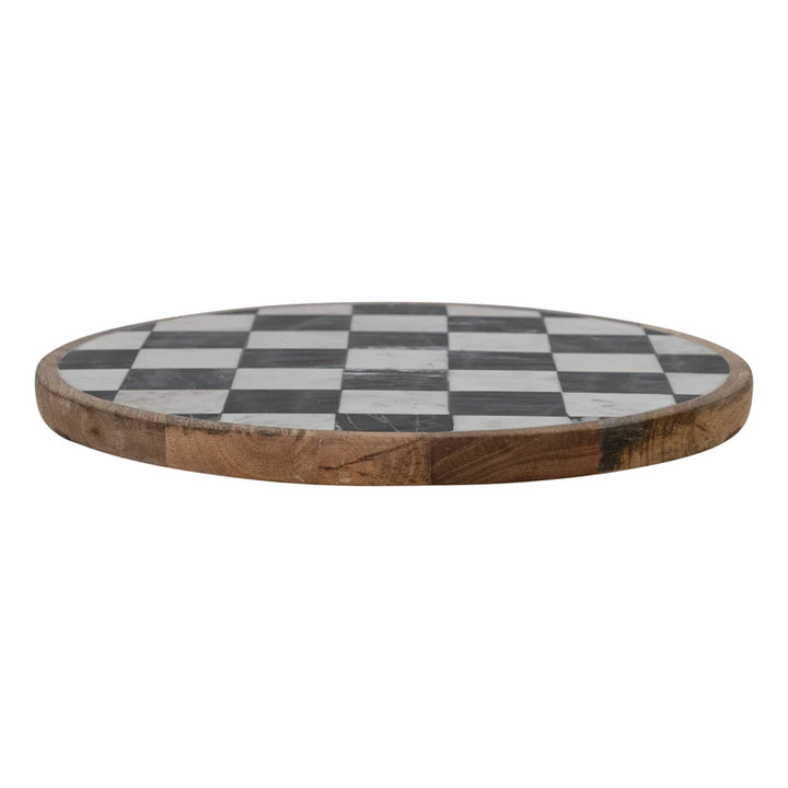 Round wooden lazy susan with a checkered pattern on a white background