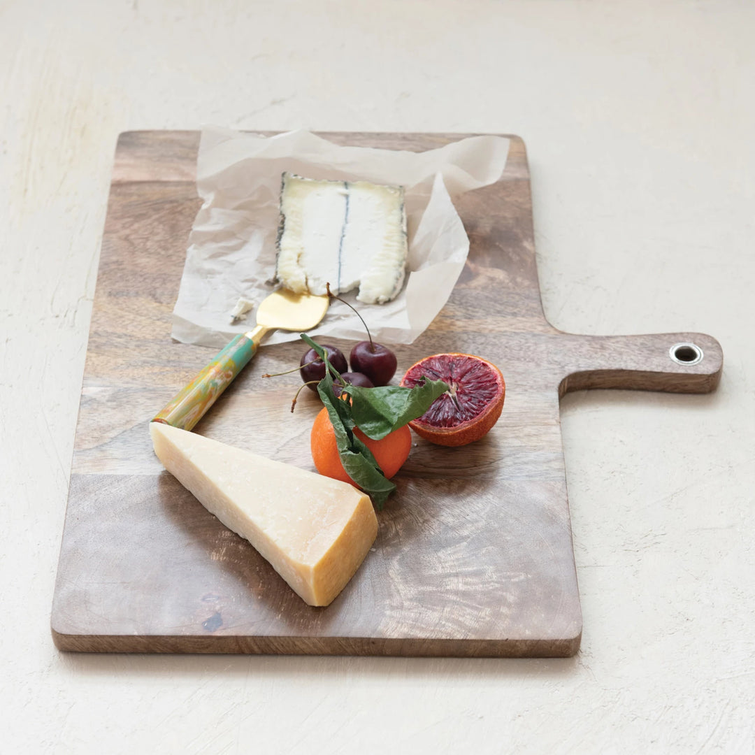 large wooden cutting board with handle