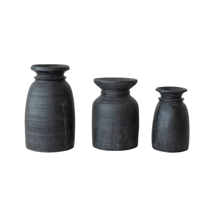 black wood vases of different shapes and styles on white background