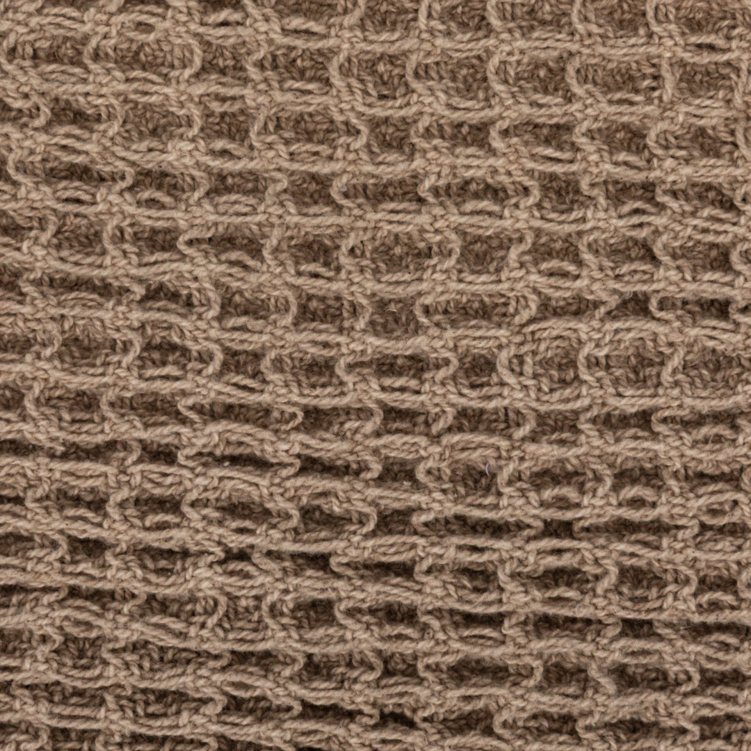 Close-up of a brown textured fabric pattern