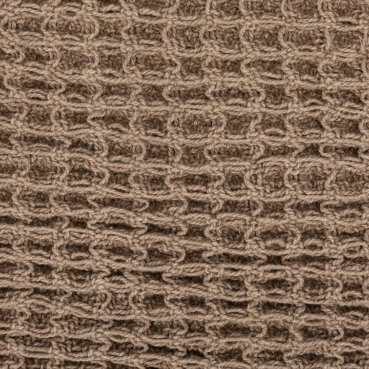 Close-up of a brown textured fabric pattern