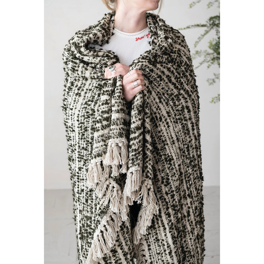 woman wrapped in soft cotton blanket