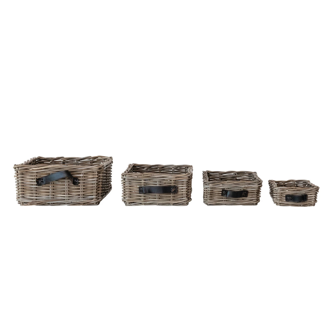 Set of four woven baskets with handles on a white background