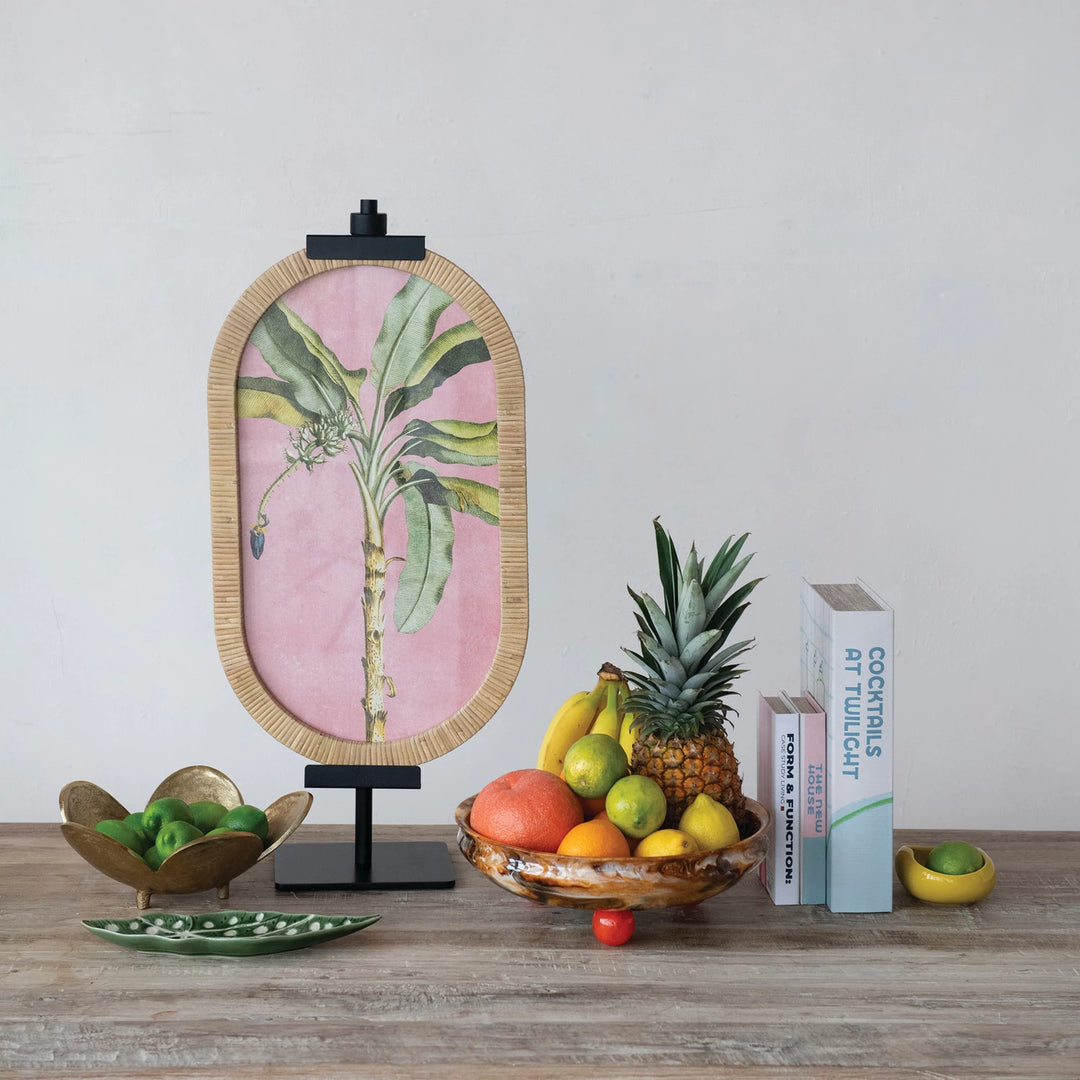 Decorative setup with a framed botanical print on easel