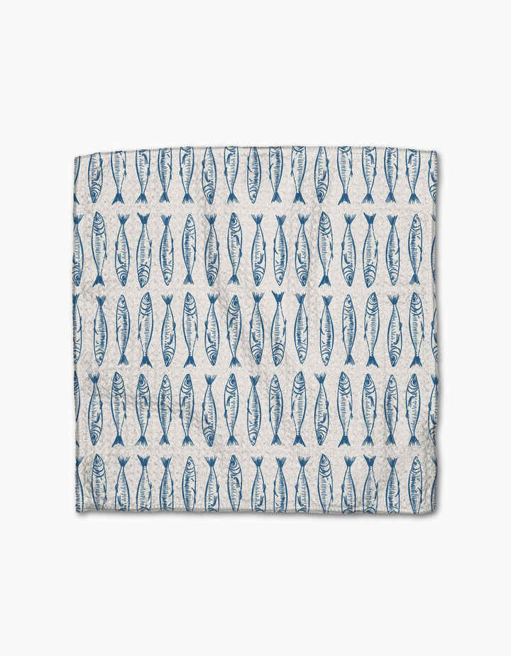 Fabric with blue fish pattern on a white background
