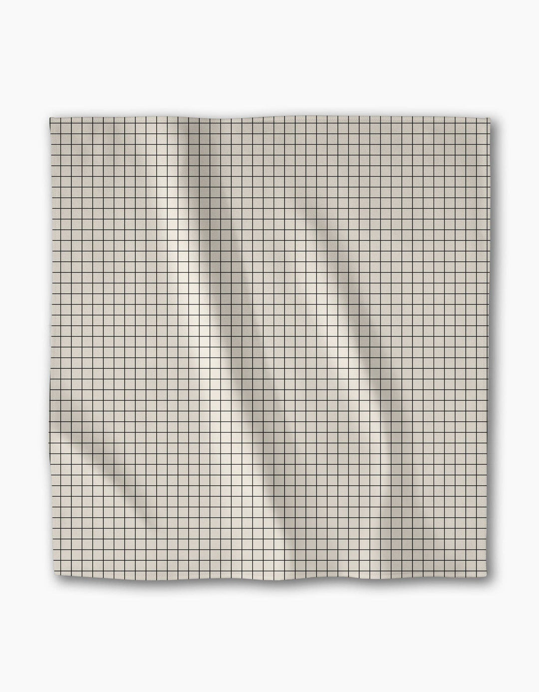 Grid-patterned dinner napkin on a white background