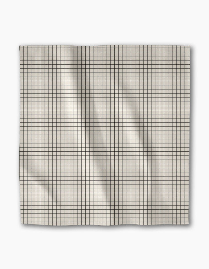 Grid-patterned dinner napkin on a white background