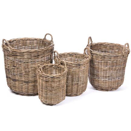 Set of four wicker baskets of different sizes on a white background