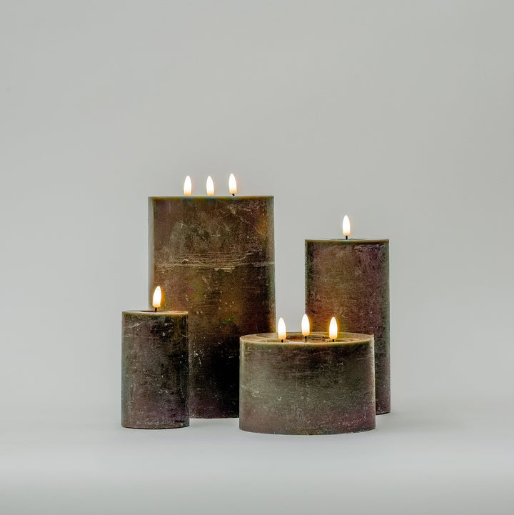 gray flameless candles in 4 different sizes