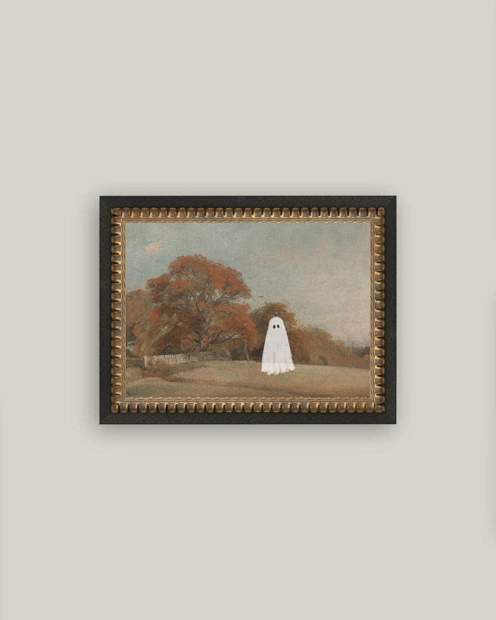 Framed artwork of a ghostly figure in a park setting on a plain wall.