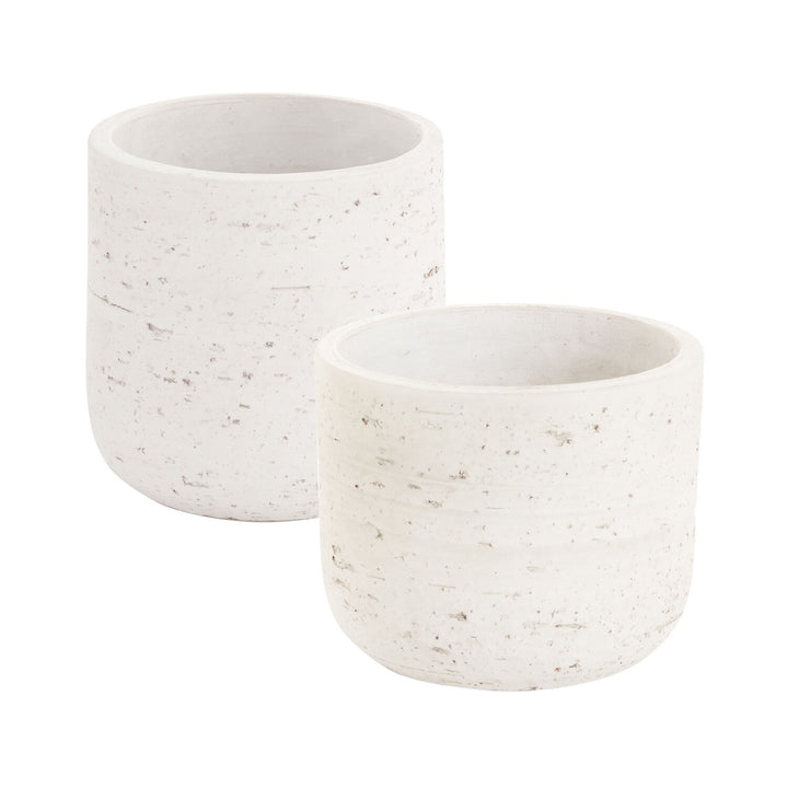Two white textured plant pots on a white background