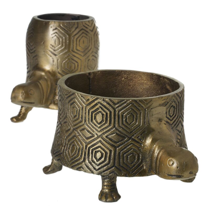 Two bronze turtle-shaped candle holders on a white background