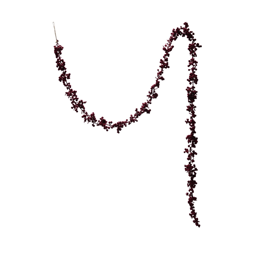 A flocked foam ball garland in burgundy color designed for Christmas decoration.